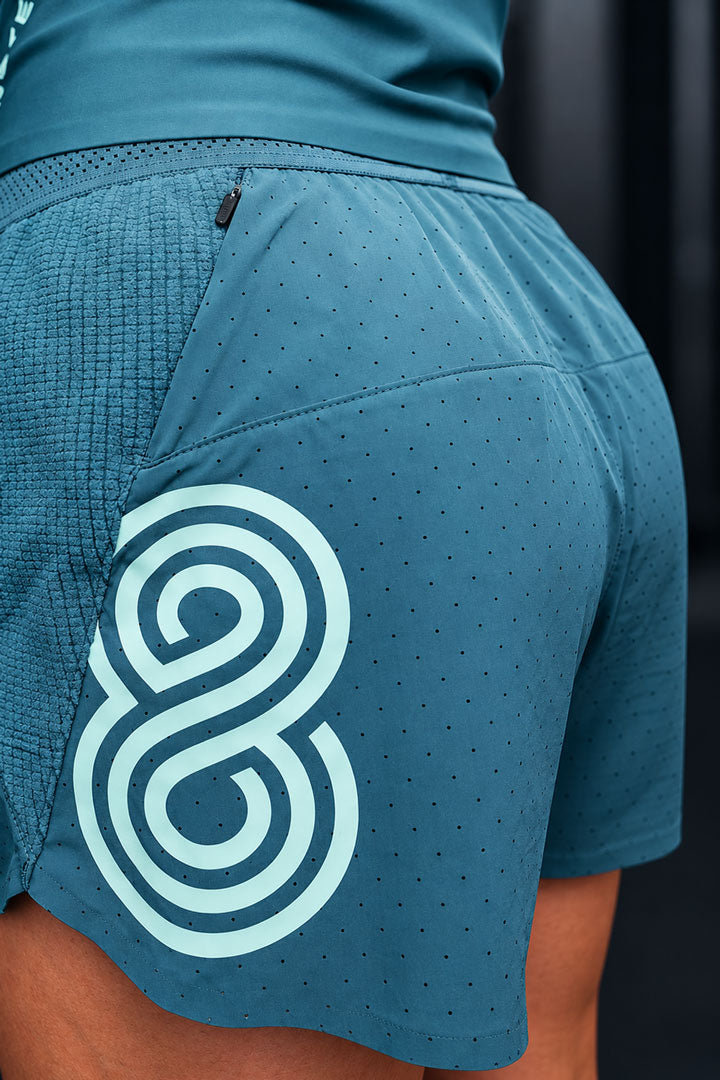 SEAMLESS HEMS — Breaking 50 Short Women Teal